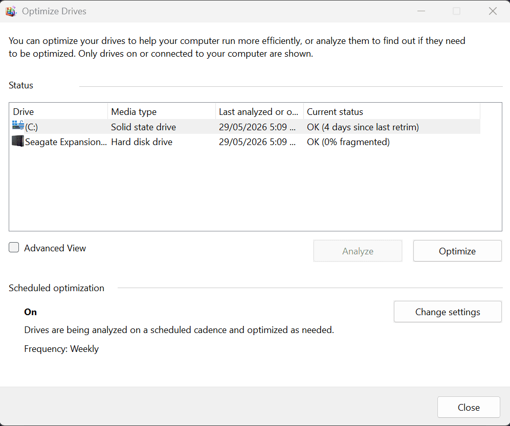 The Windows Optimize Drives tool showing the system SSD as 'Solid state drive' with status 'OK (4 days since last retrim)' and a hard drive at '0% fragmented'.