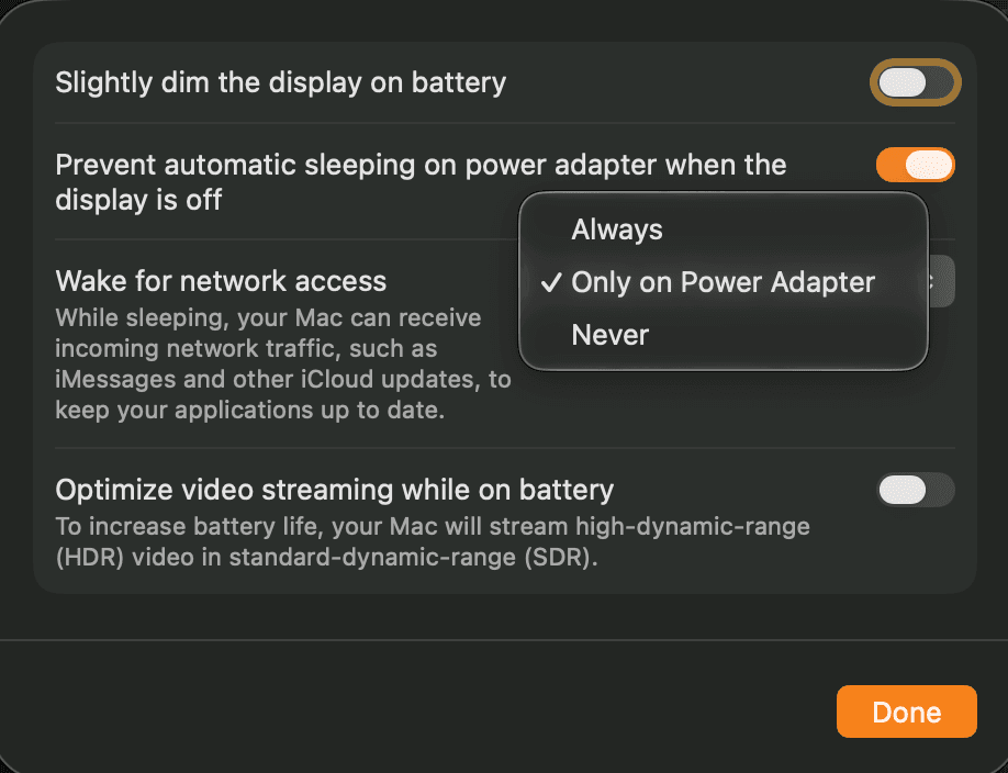 The macOS energy options sheet showing Prevent automatic sleeping when the display is off enabled and the Wake for network access option set to Only on Power Adapter.