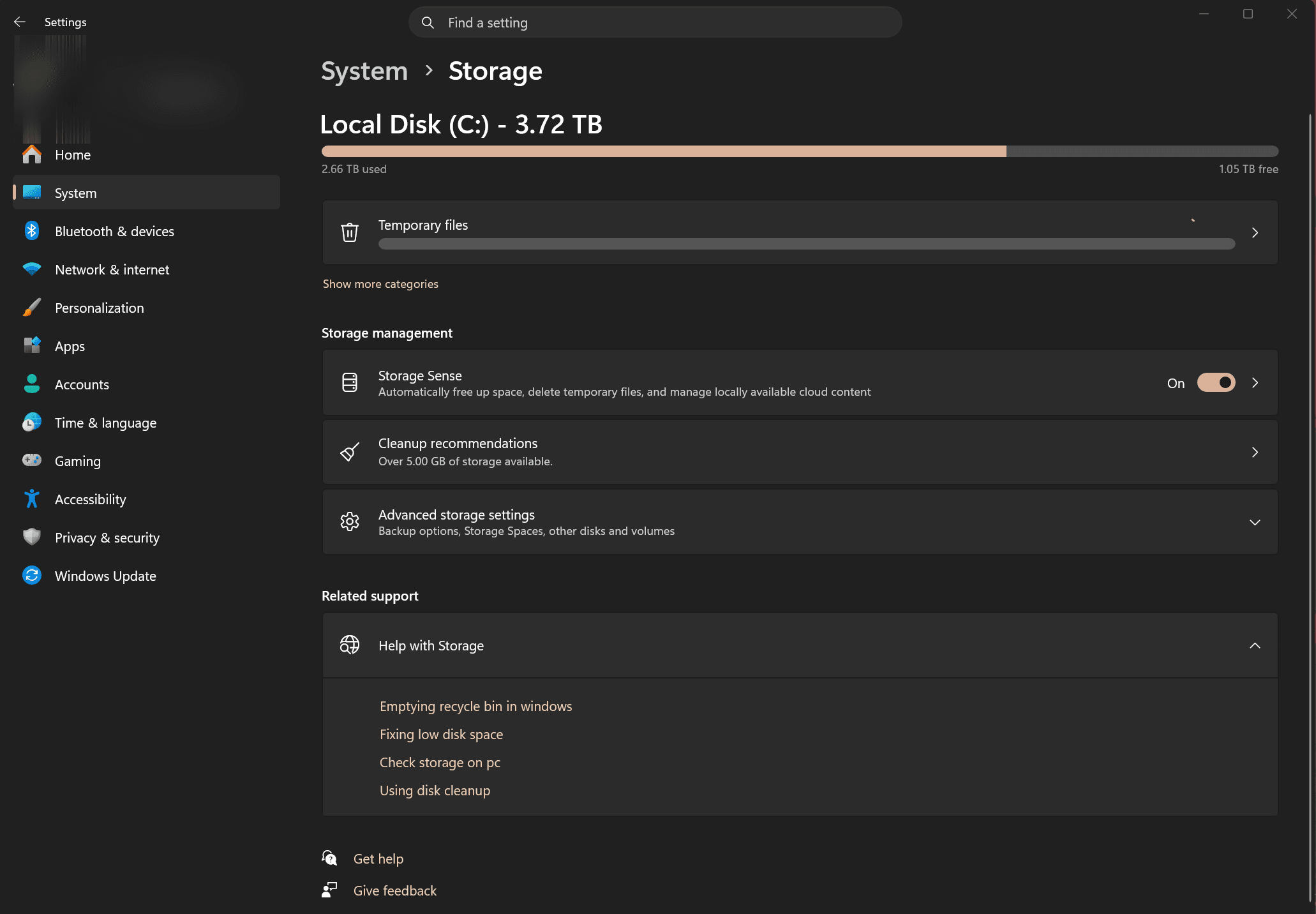 Windows 11 Settings System Storage page showing the C: drive usage bar, Temporary files, and the Storage management section with Storage Sense on and Cleanup recommendations.